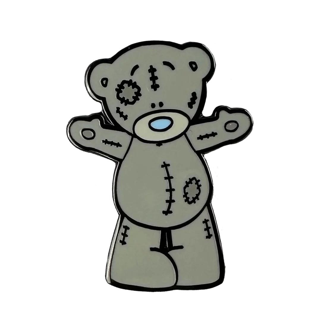 a teddy bear with a cross on its chest