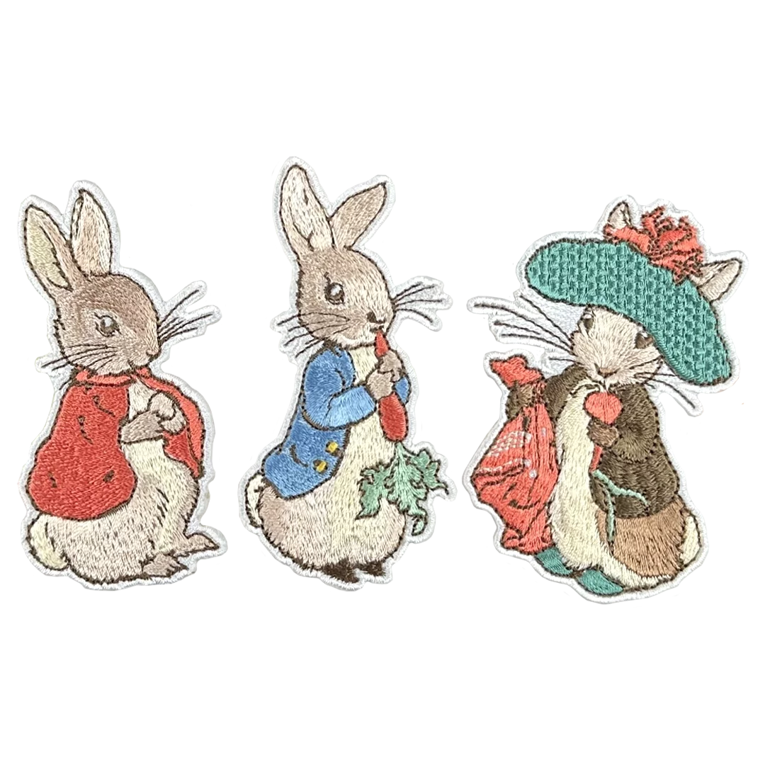 a group of three rabbits with hats on