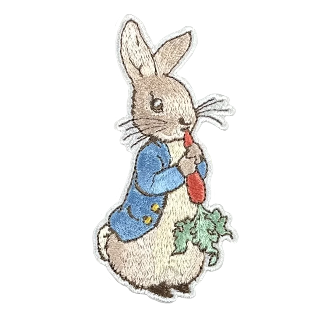 a picture of a rabbit holding a carrot