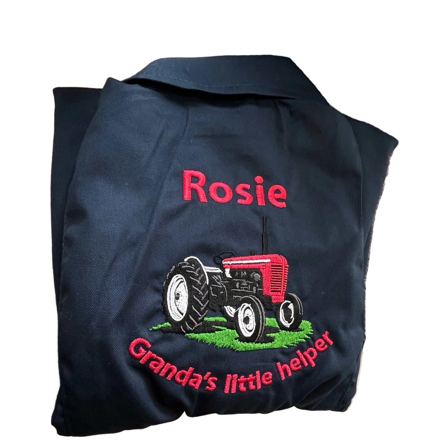 Navy blue jacket with embroidered red tractor and 'Rosie Granda's little helper' text on a textured surface.