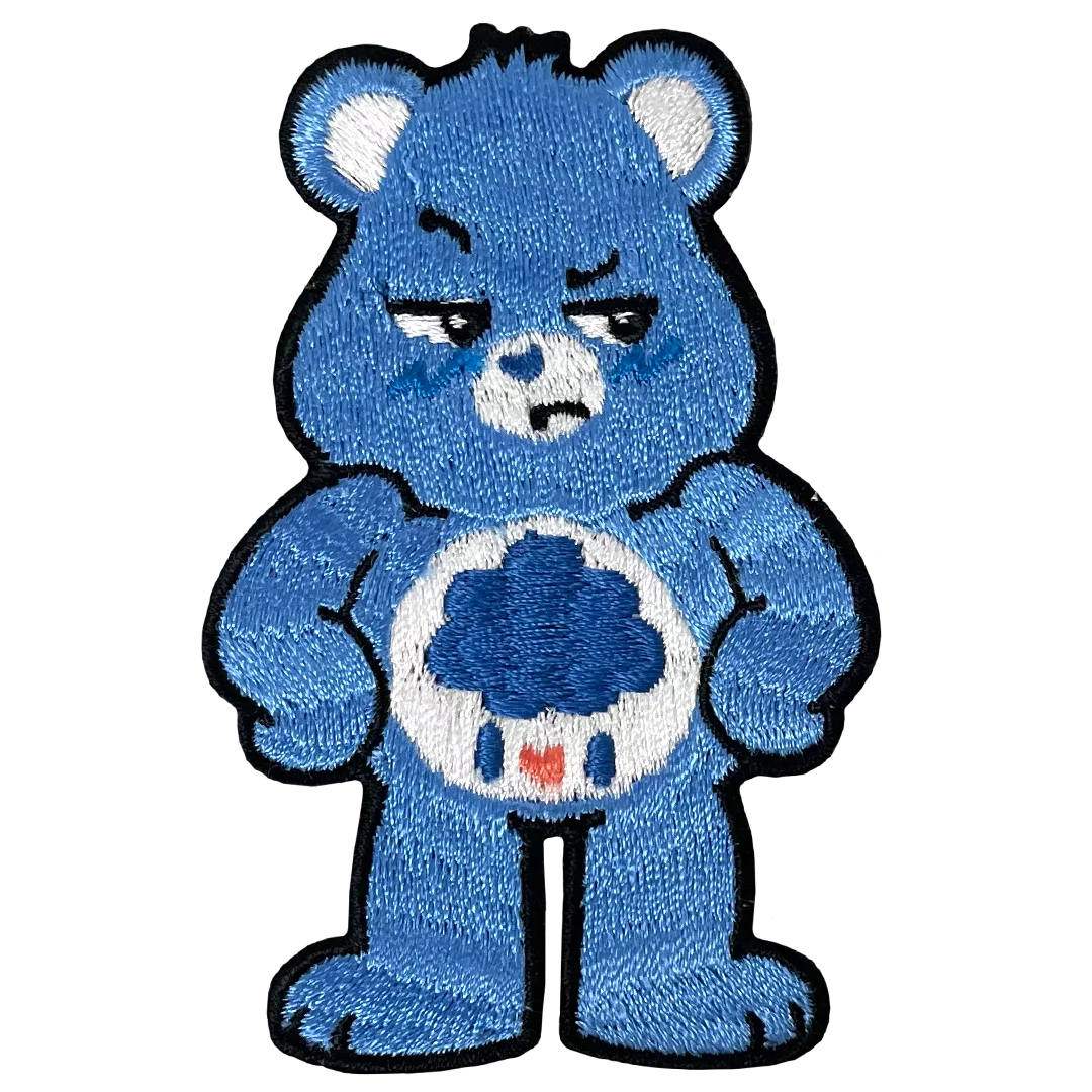 a blue teddy bear holding a soccer ball