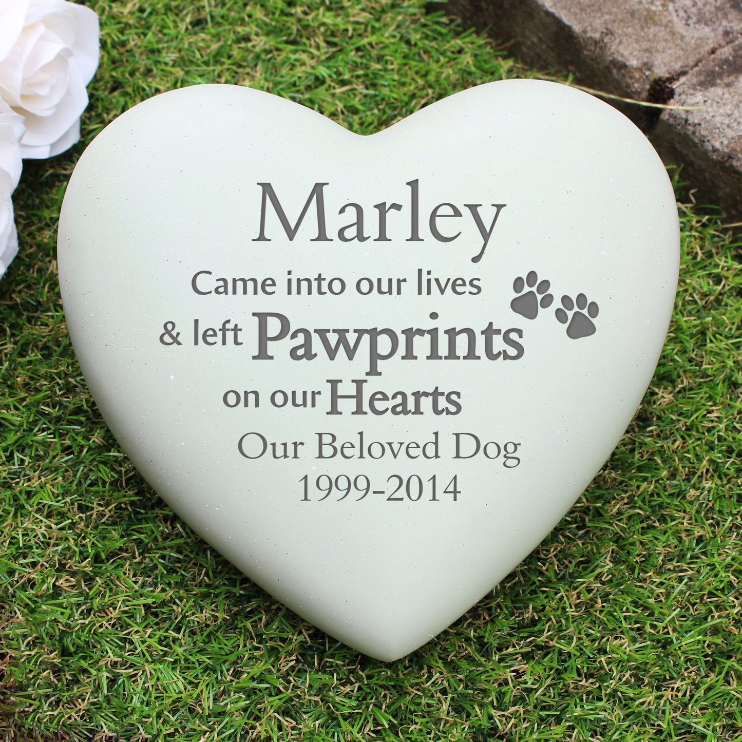 a white heart with a paw prints on it