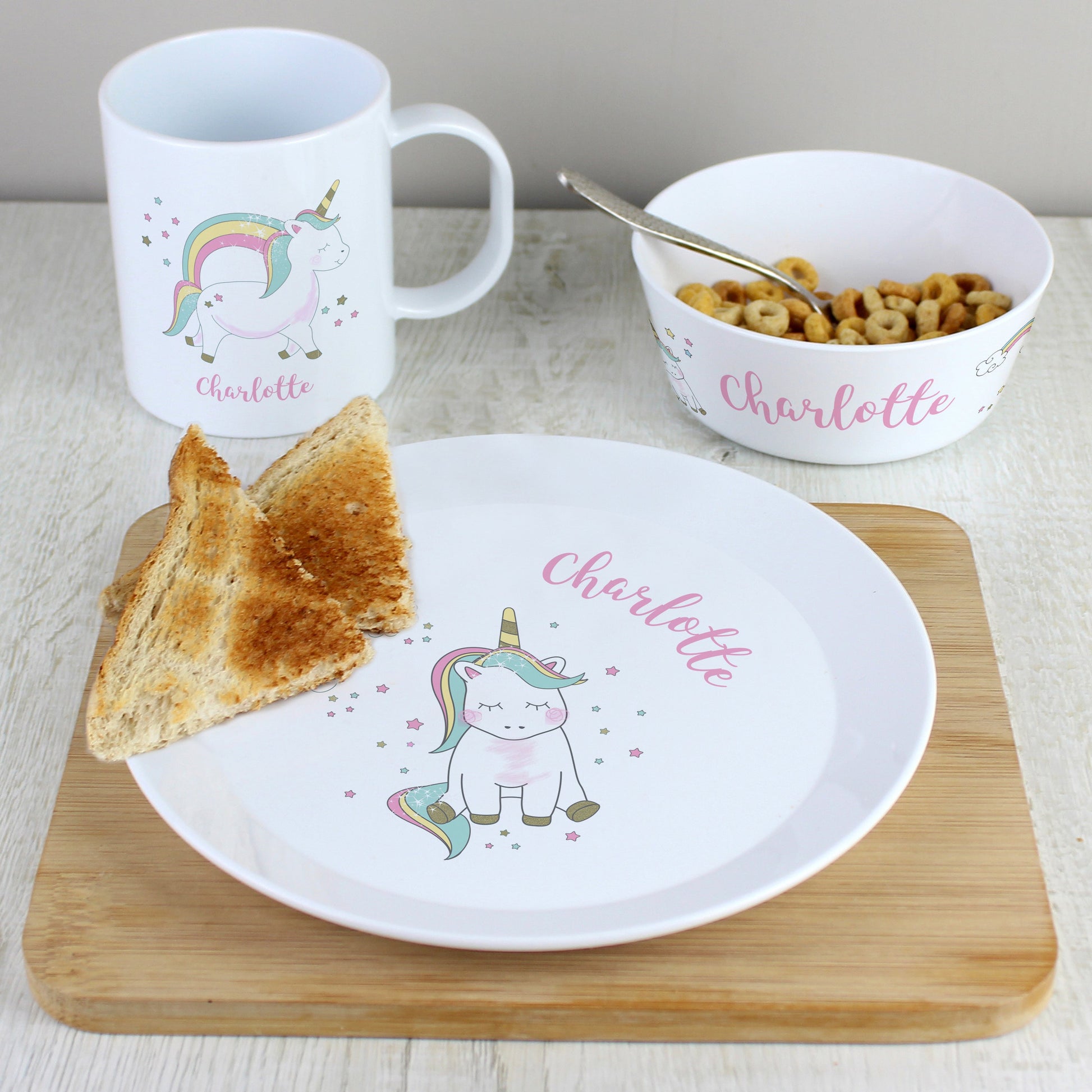 a white plate topped with a piece of bread next to a bowl of cereal