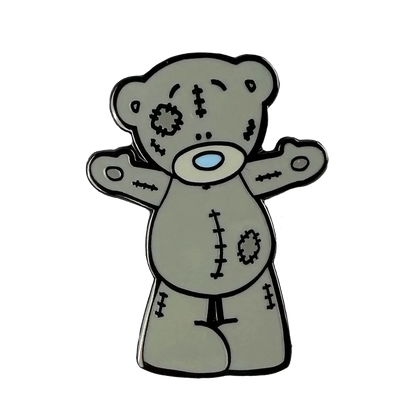 a teddy bear with a cross on its chest