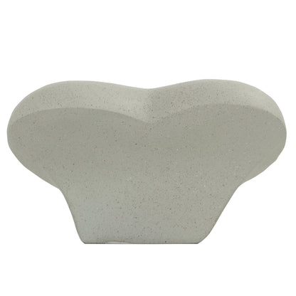 a white vase shaped like a heart on a white background