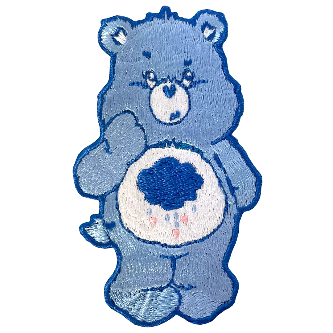 a blue teddy bear with a heart on it's chest