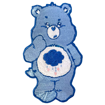 a blue teddy bear with a heart on it's chest