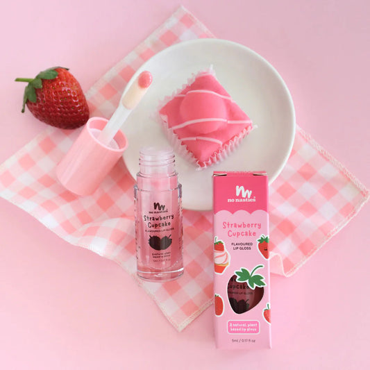 a strawberry cupcake next to a strawberry milkshake