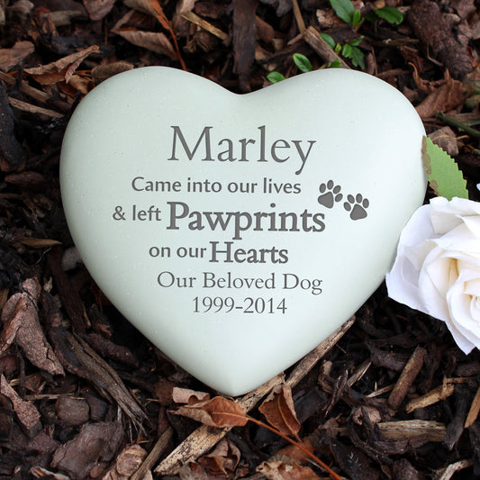 a white heart with a paw prints on it