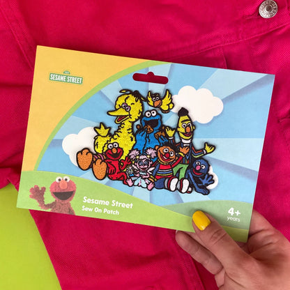 a person holding a card with a picture of cartoon characters on it