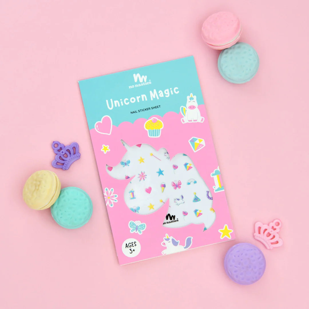 a book with a unicorn on it next to some cookies