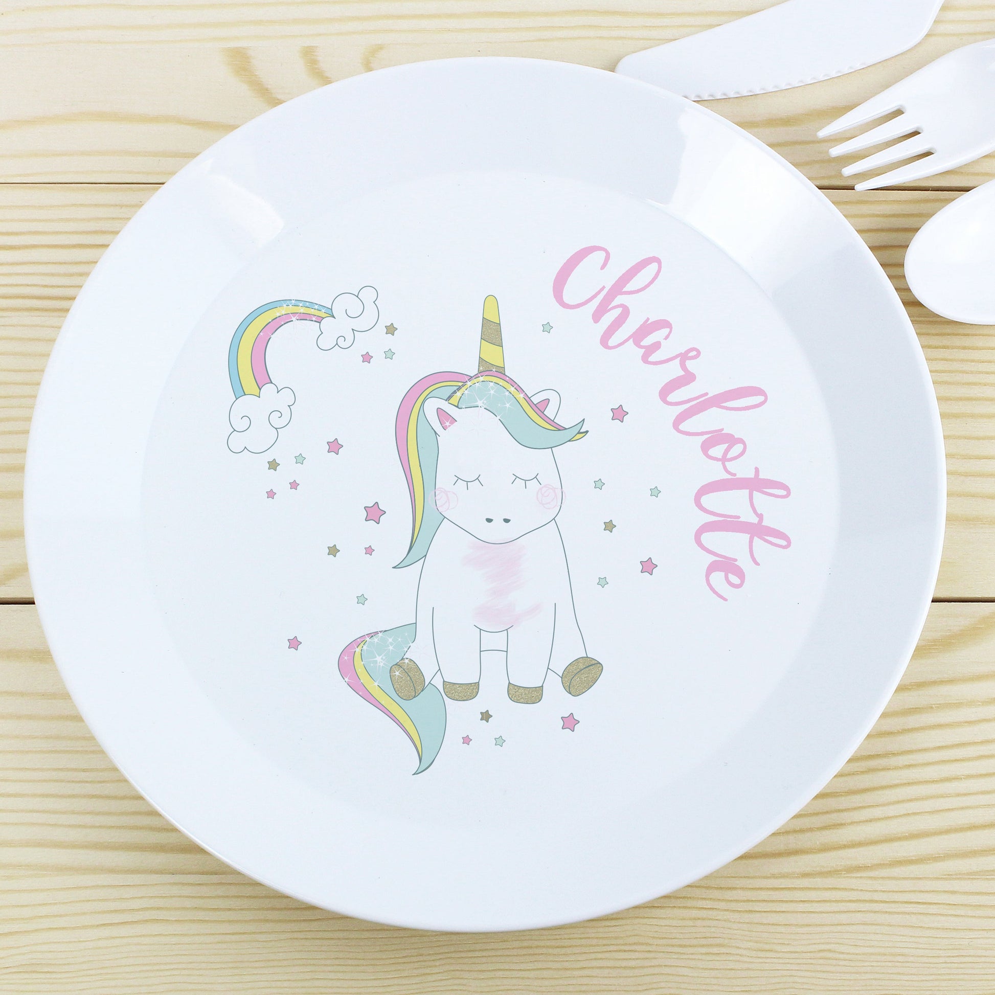 a white plate with a unicorn on it