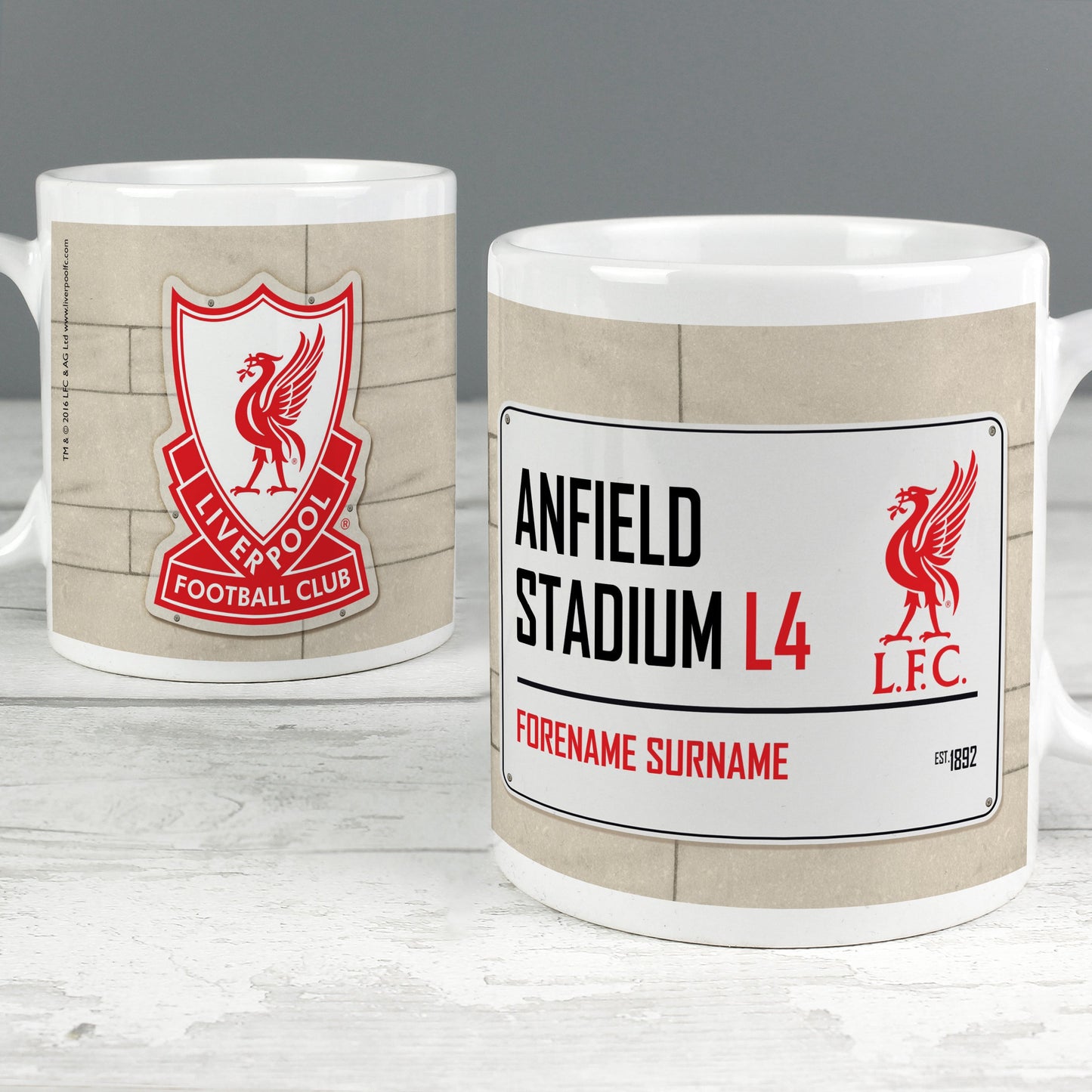 a close up of two coffee mugs on a table