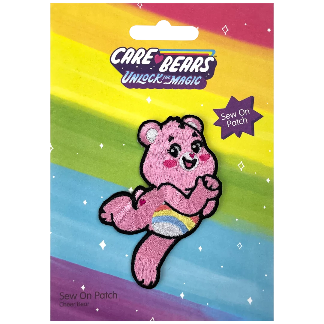 a pink teddy bear with a rainbow background