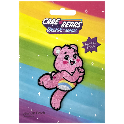 a pink teddy bear with a rainbow background