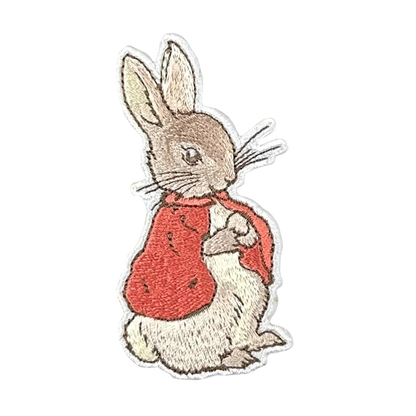 a white rabbit with a red shirt on