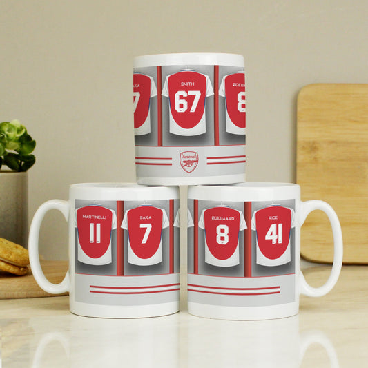a couple of white coffee mugs sitting on top of a table