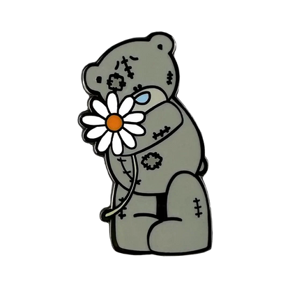 a picture of a teddy bear holding a flower