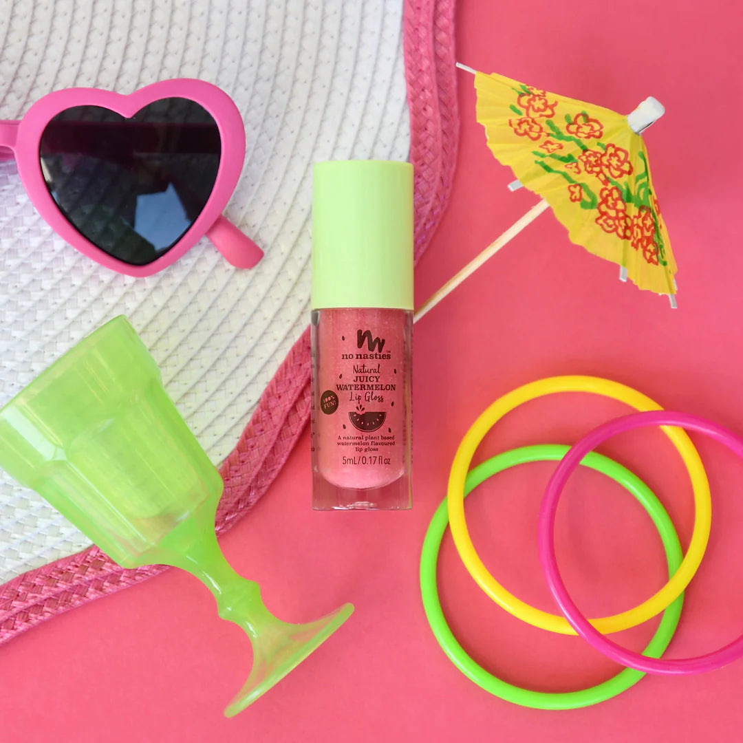 a pink bag with sunglasses, a straw hat, and a bottle of nail polish