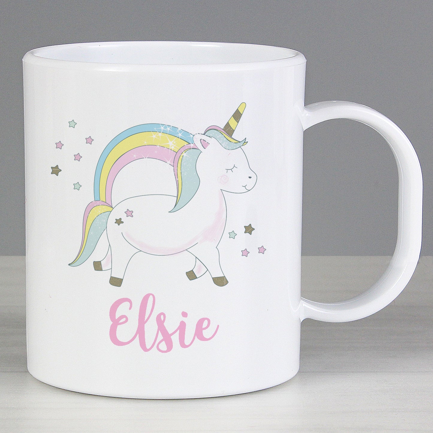 a white coffee mug with a unicorn on it