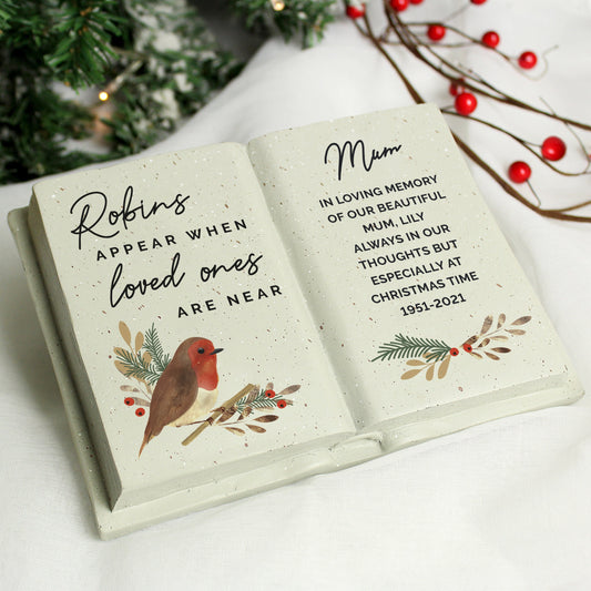an open book with a christmas message on it