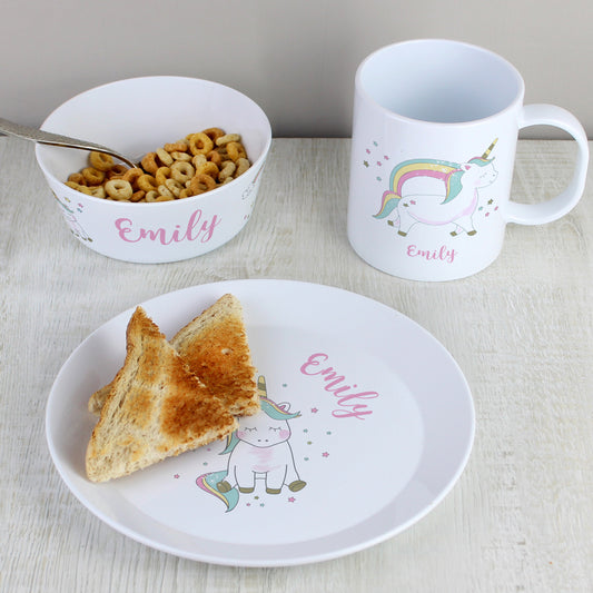 a white plate topped with a slice of pizza next to a cup of cereal