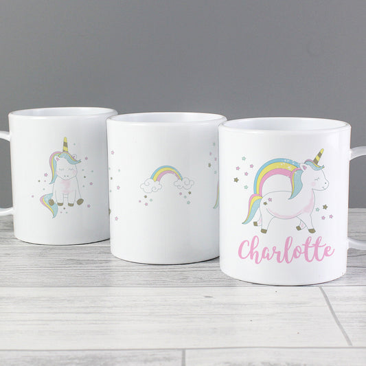 three coffee mugs with unicorns and rainbows on them