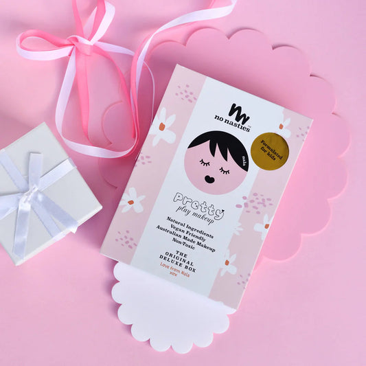 a package of makeup on a pink background