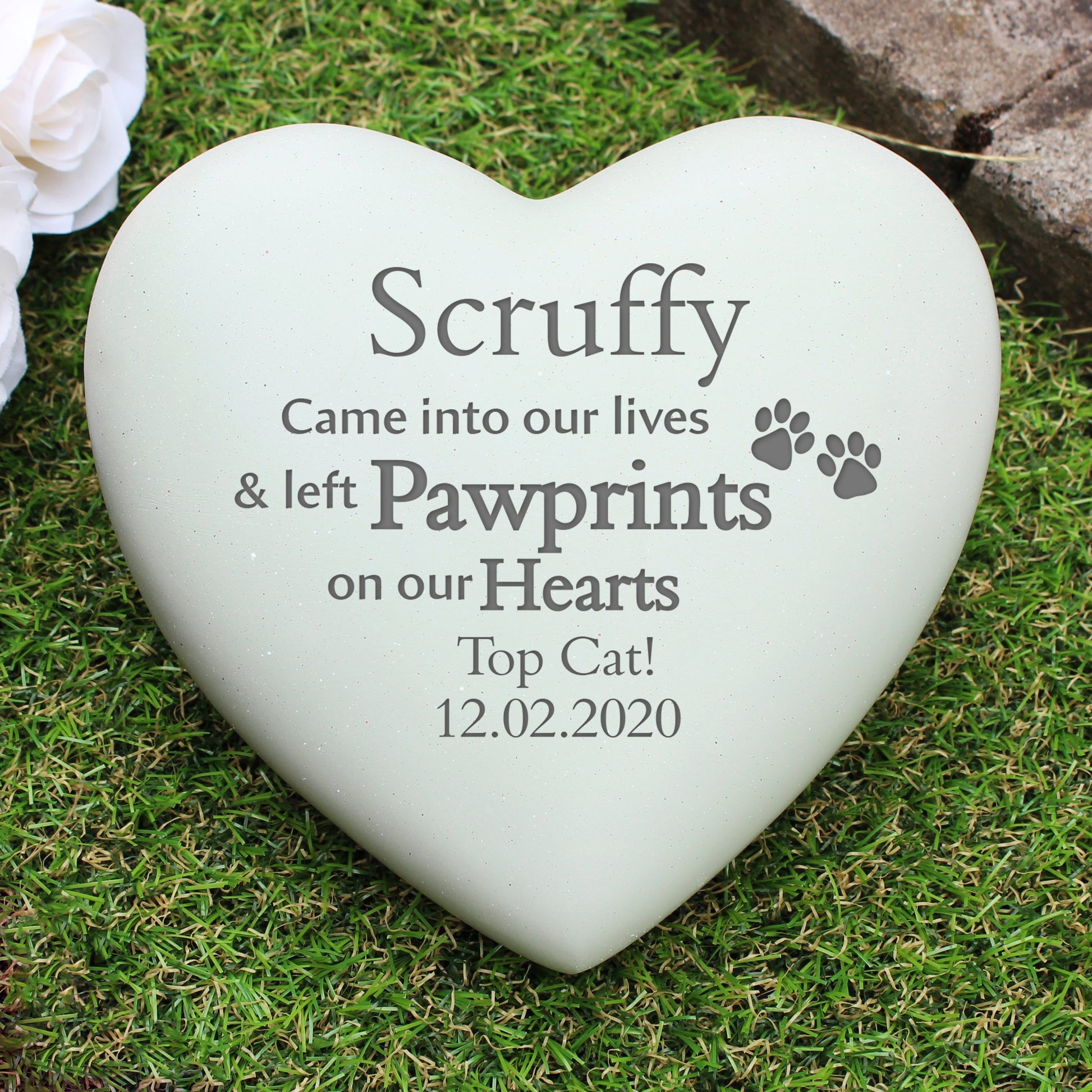a white heart with a paw prints on it