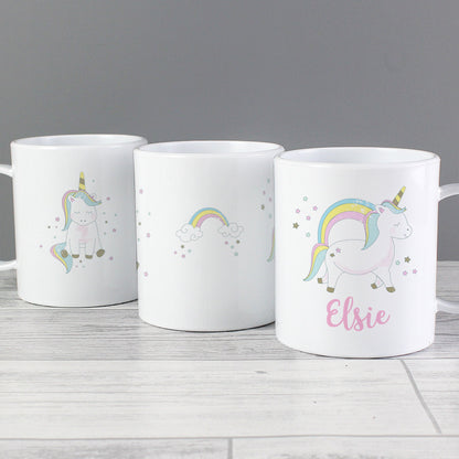 three coffee mugs with unicorns and rainbows on them