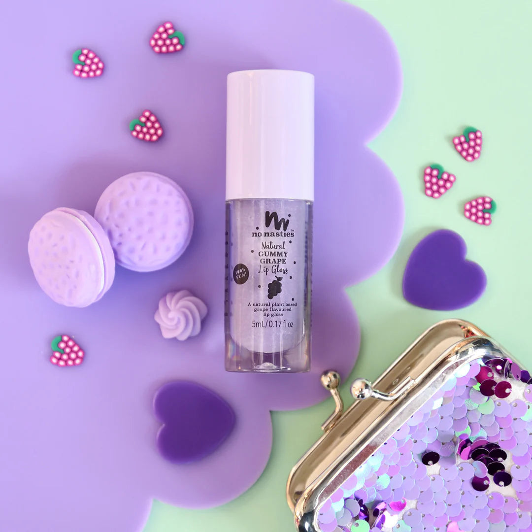 a close up of a bottle of makeup next to a purse
