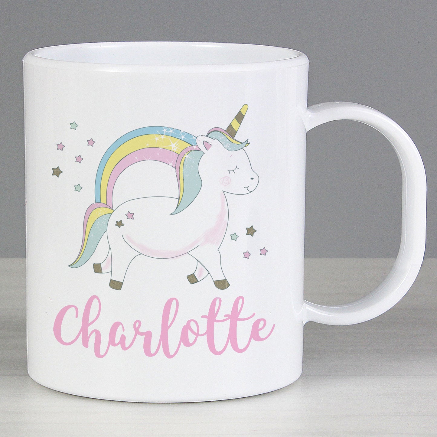 a white coffee mug with a unicorn on it