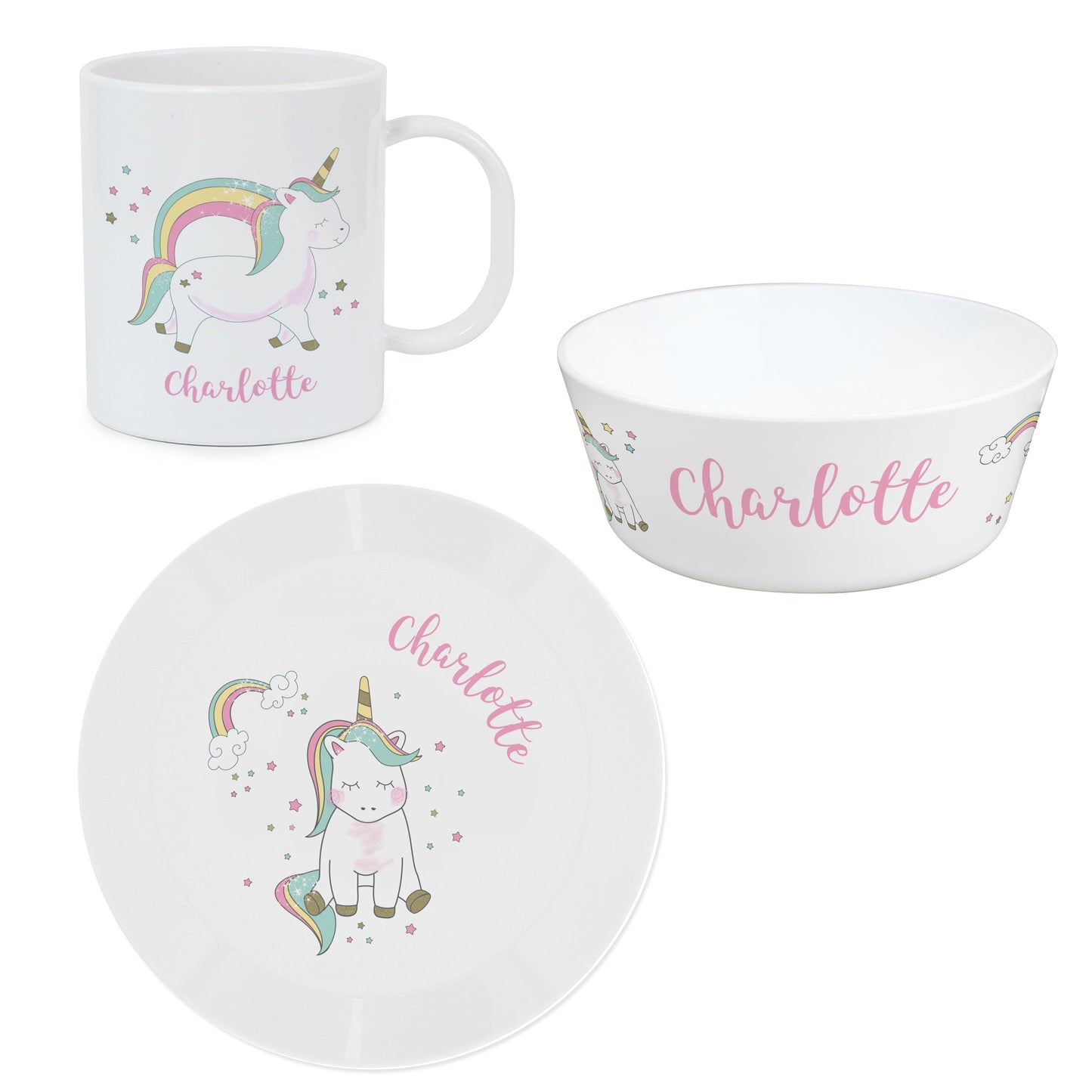 a cup, plate and bowl with a unicorn on it