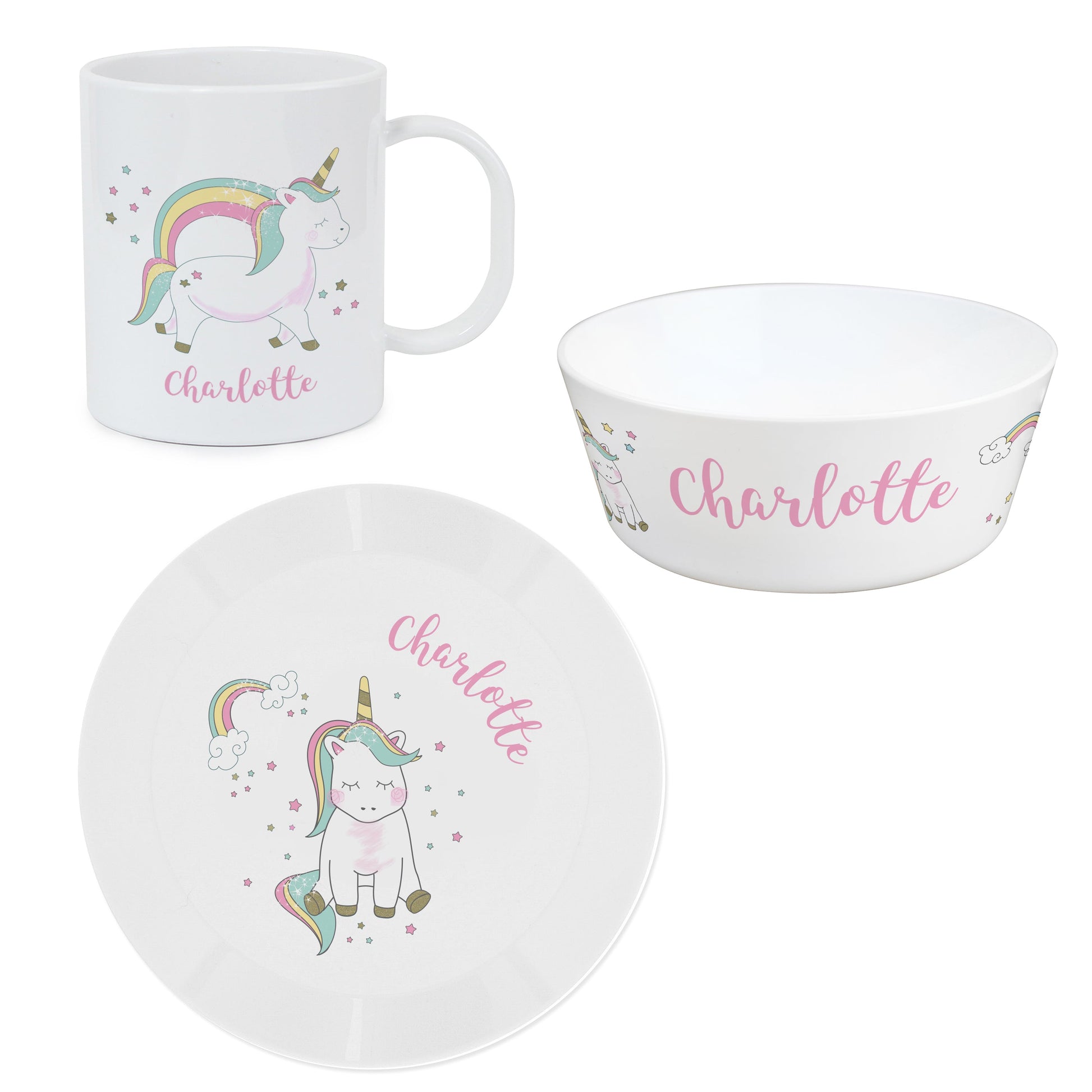 a cup, plate and bowl with a unicorn on it